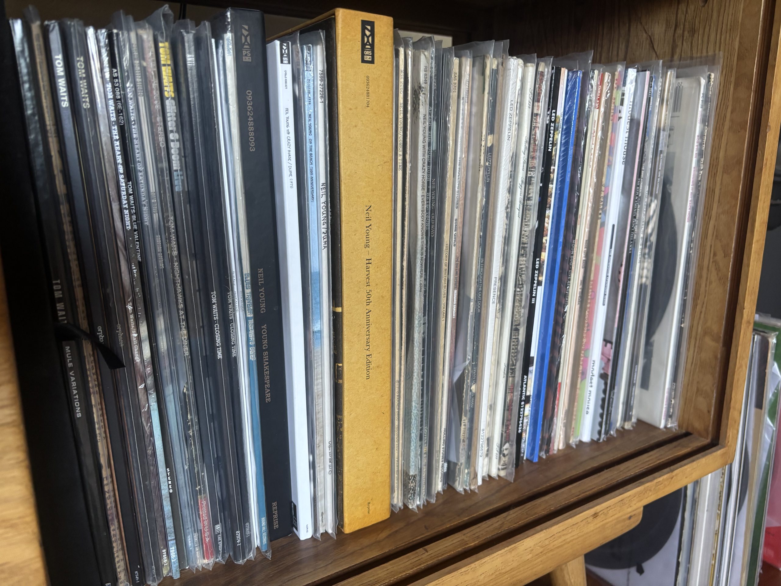 Shelf filled with original vinyl pressings, 180 gram reissues, and boxed record sets