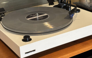 Fluance turntable playing a Buffalo Nichols vinyl record in a modern listening setup