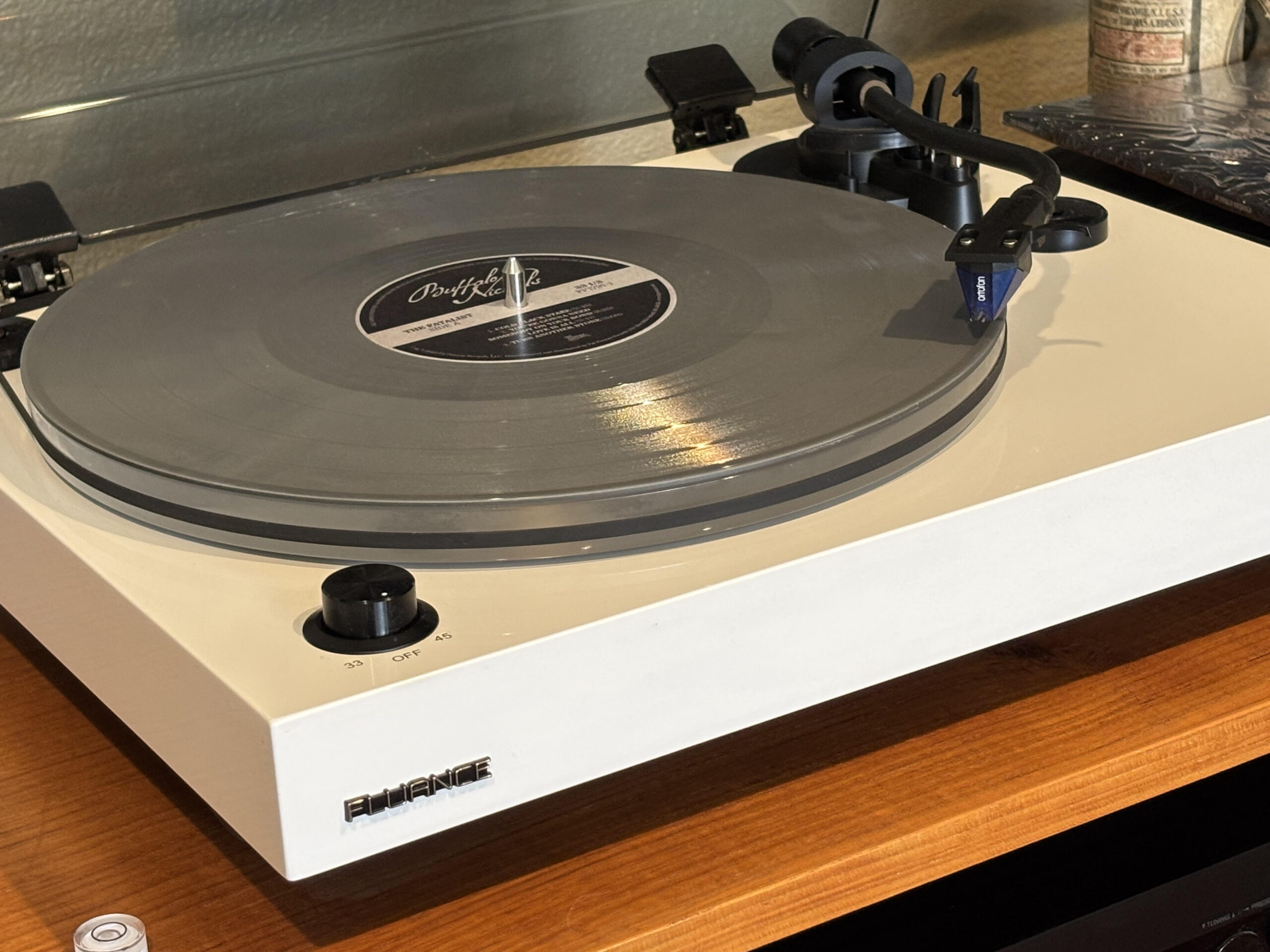 Fluance turntable playing a Buffalo Nichols vinyl record in a modern listening setup