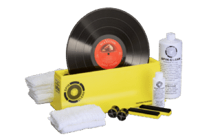 Spin Clean vinyl record cleaner washing an LP to remove dust and grime