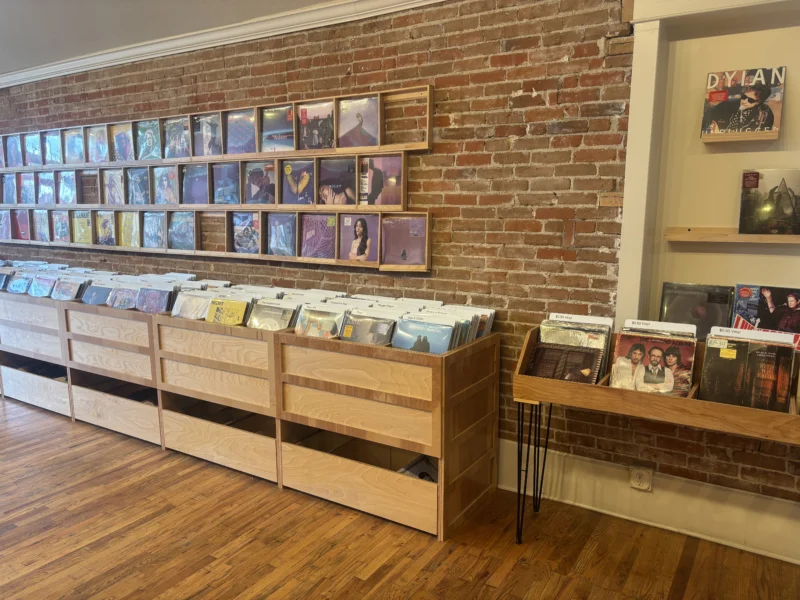 Inside Records on Main in Littleton, Colorado Interior of Records on Main in Littleton, Colorado, featuring rows of vinyl records, music memorabilia, and browsing customers.