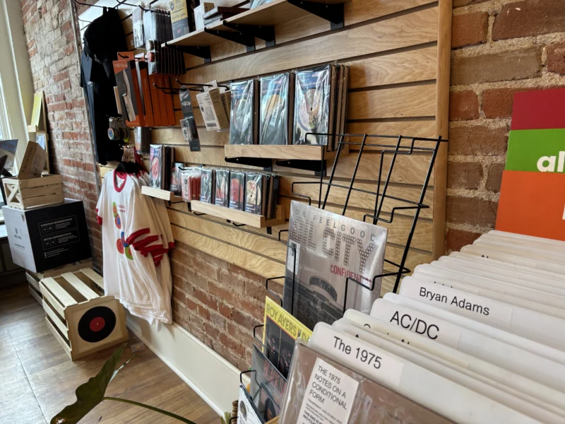 Vinyl record accessories displayed inside Records on Main in Littleton, Colorado, including record cleaning supplies, sleeves, turntable accessories, and audio gear.