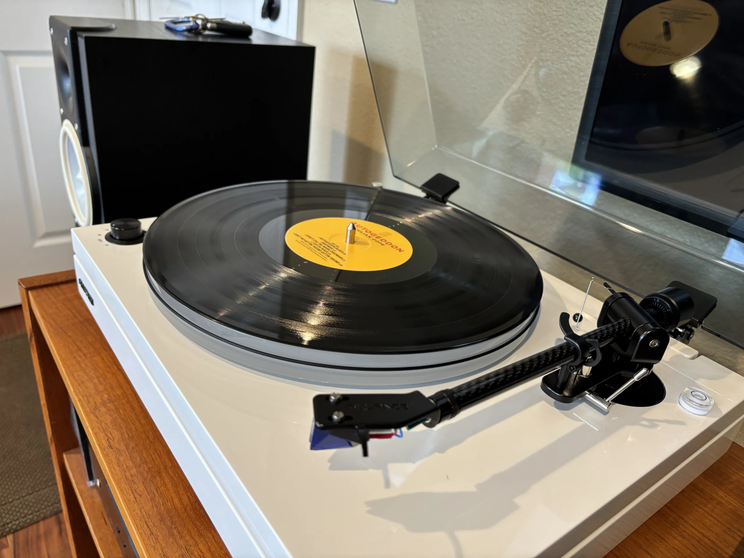 Close-up of the Fluance RT87 carbon fiber tonearm highlighting its lightweight construction and precision tracking design