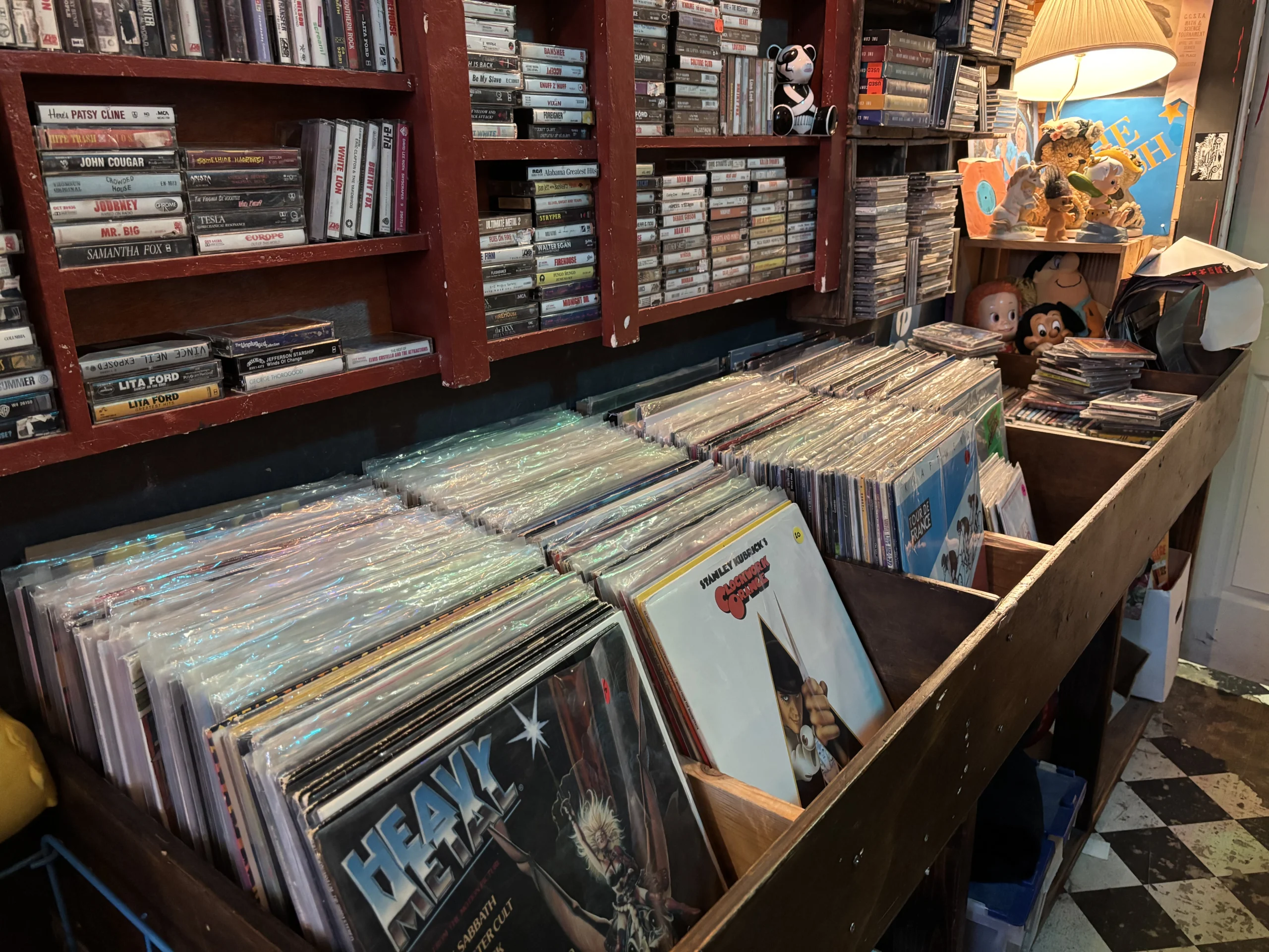 Rows of used vinyl record bins at Scavenged Goods vintage store in Denver, Colorado.