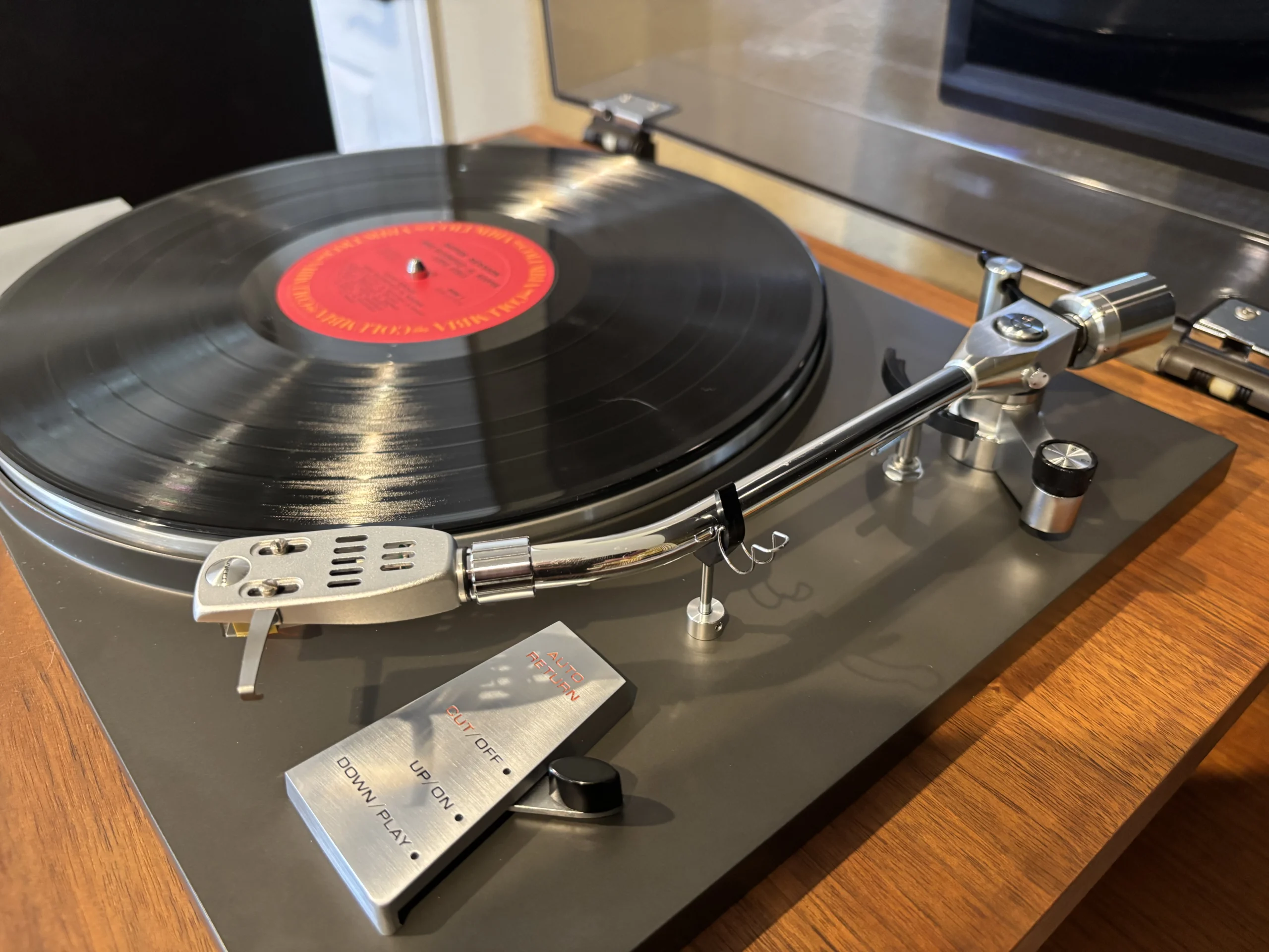 Pioneer PL-50 Tonearm Close-Up Close-up of the Pioneer PL-50 turntable tonearm and headshell during cartridge setup on a vintage belt-drive record player.