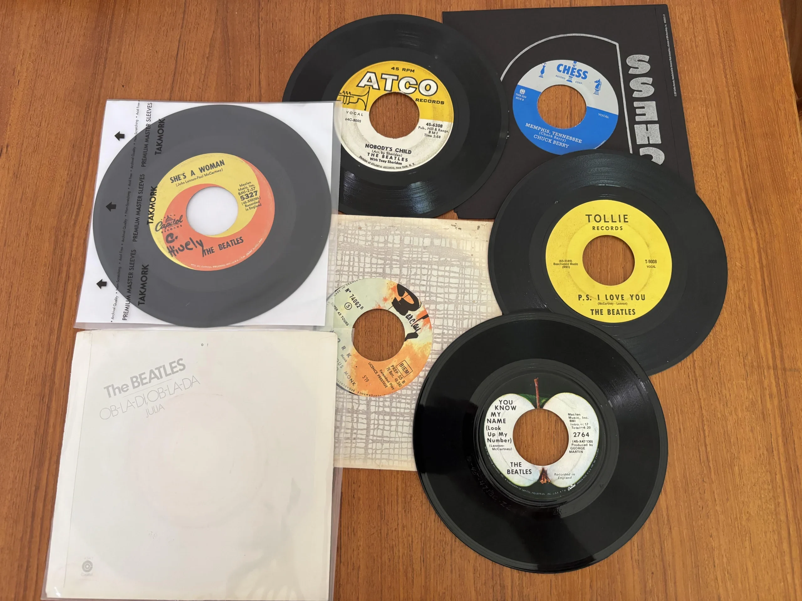 Beatles and Chuck Berry 45 RPM records displayed for a jukebox article